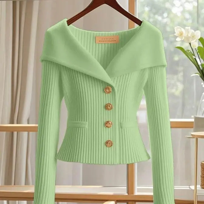 Light green ribbed women's cardigan with gold buttons and wide collar on hanger